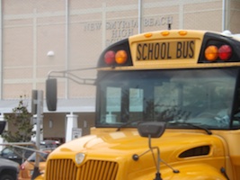 School bus leaves New Smyrna Beach High School / Headline Surfer